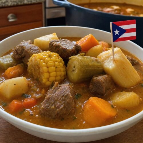 Puerto Rican sancocho with tender beef, corn, green plantain and root vegetables in a rich sofrito broth