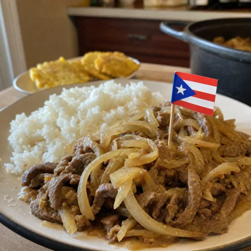 Authentic Puerto Rican bistec encebollado: marinated steak stewed with onions until fork-tender in a savory gravy. A true home-style comfort dish.